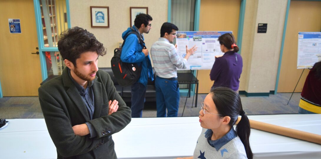 ITE members participating in the CME Poster competition - A group of students at a conference.